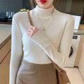 Slim fit long sleeve knitted shirt in viscose fibre shown in apricot colour.