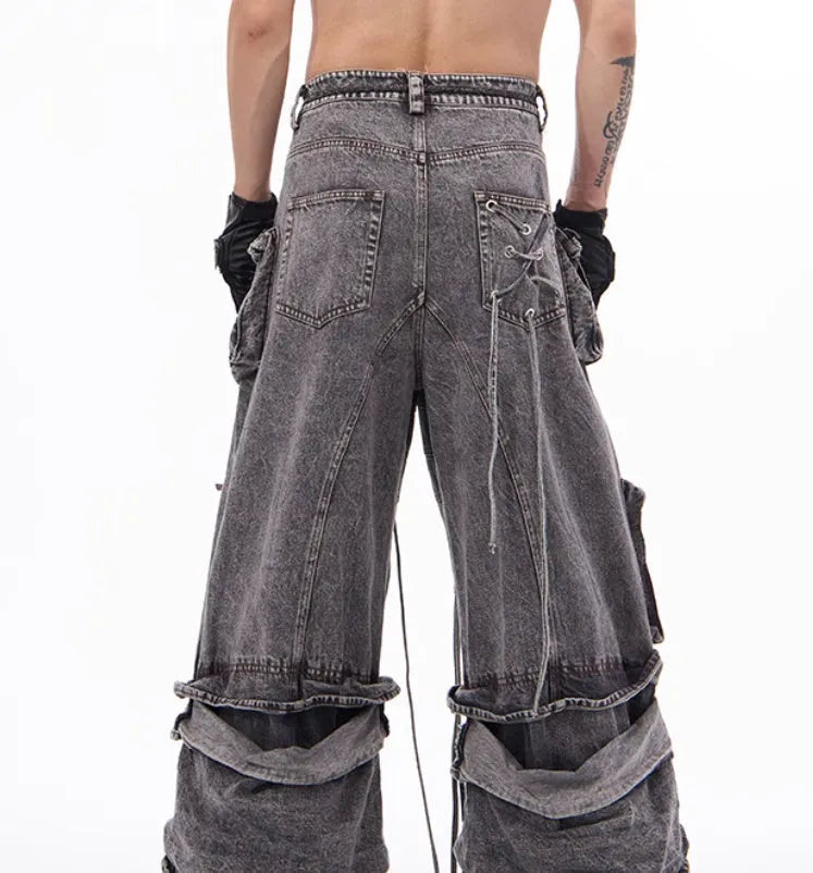 Grey cotton denim overalls with distressed finish and rope stitching on the legs.
