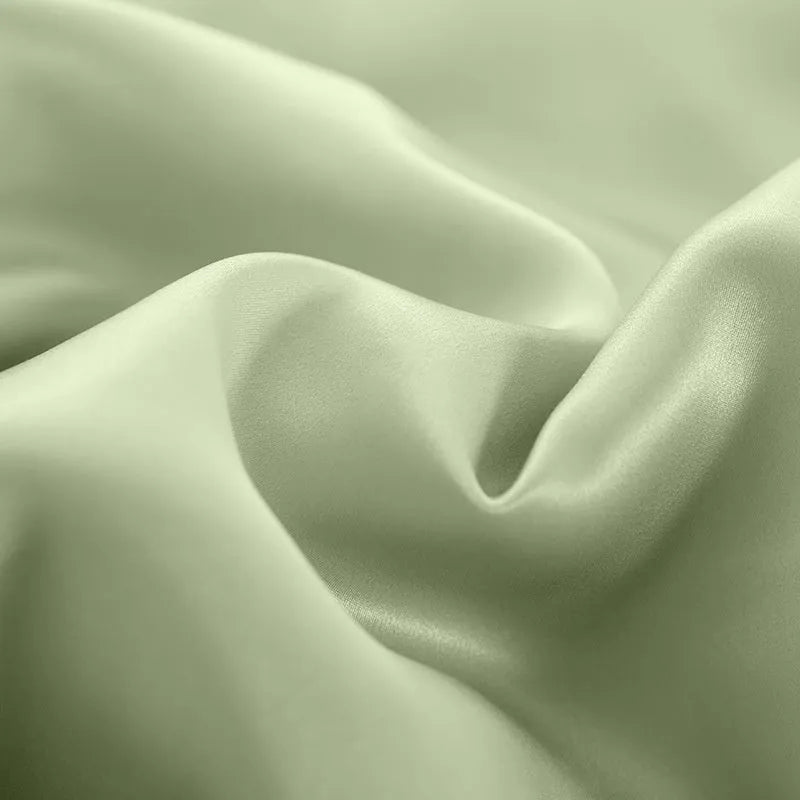 Solid colour double-sided silk duvet cover shown in bright brown, with other colour swatches for Lotus Pink, pea green, mysterious purple, white, and silver blue.