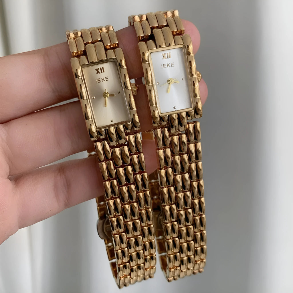 Women's mid-century inspired bracelet watch with 15mm dial and butterfly clasp in silver and gold colour options