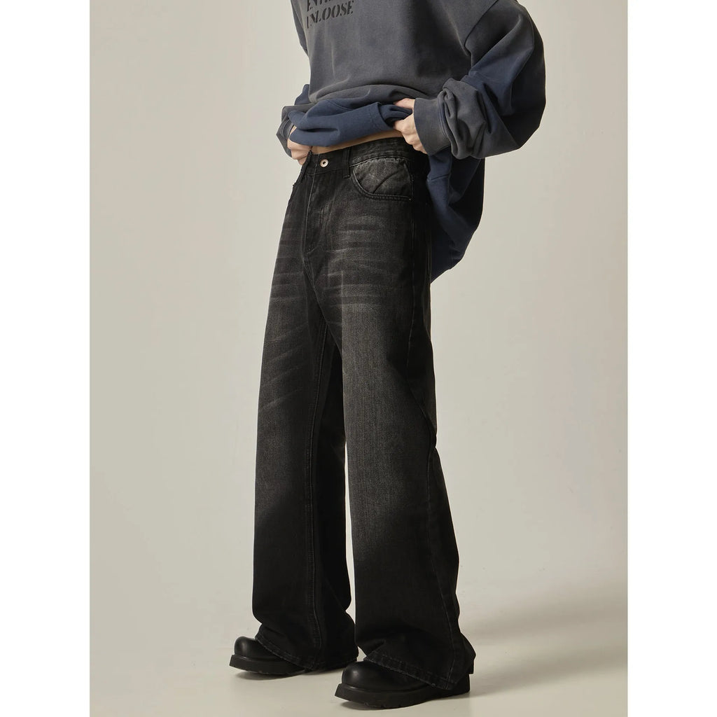Black loose straight-leg retro jeans with zip fly opening on mannequin