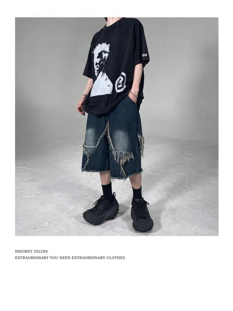Blue men's loose-fit denim shorts with a frayed five-pointed star detail on the leg, showing American retro style.