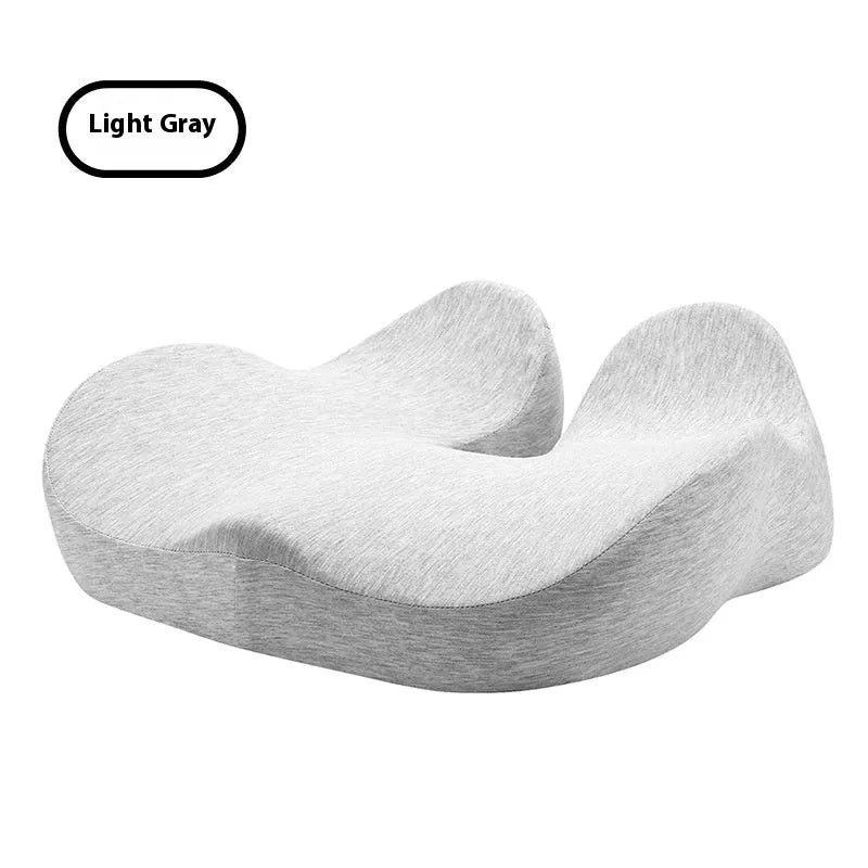 Light grey memory foam office chair cushion on a black desk chair.