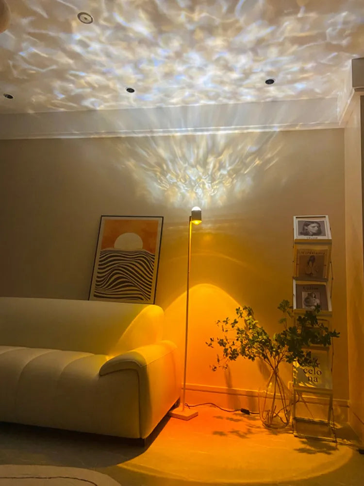 Sunset red floor lamp projecting a water wave light pattern onto a wall in a modern room.