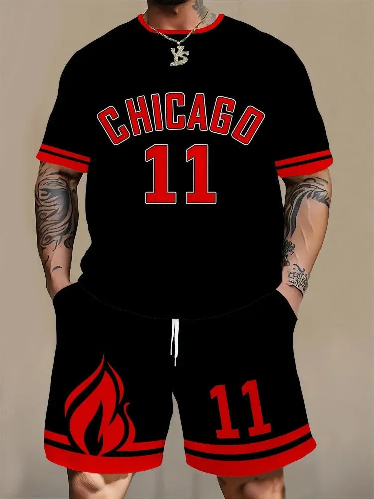 Man wearing a men's short sleeve top and shorts set with a 3D printed letter design, in a sportswear setting.