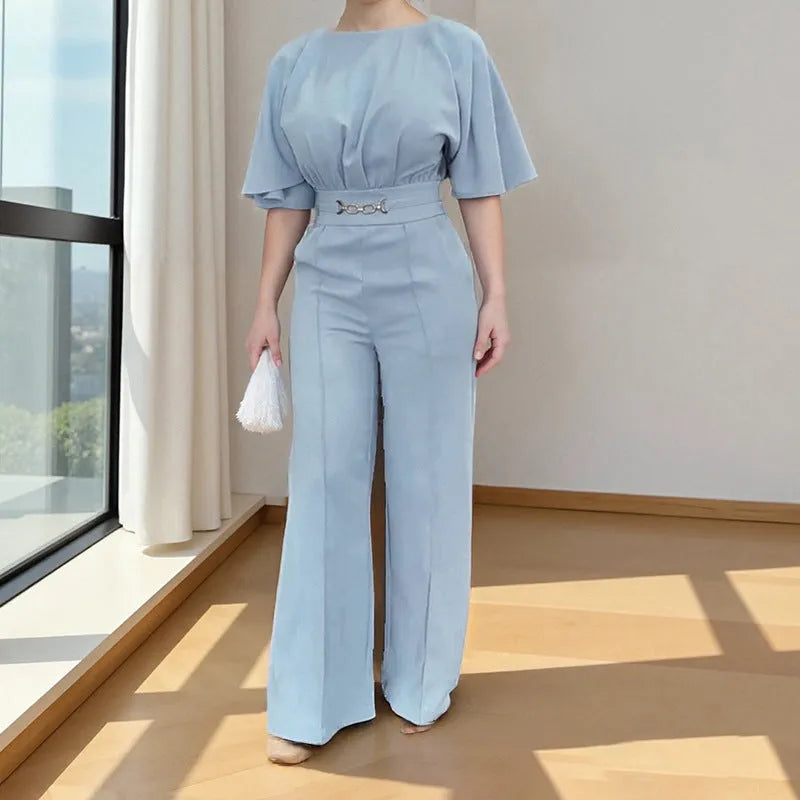 Blue polyester men's suit set with trousers and a long-sleeved top on a hanger