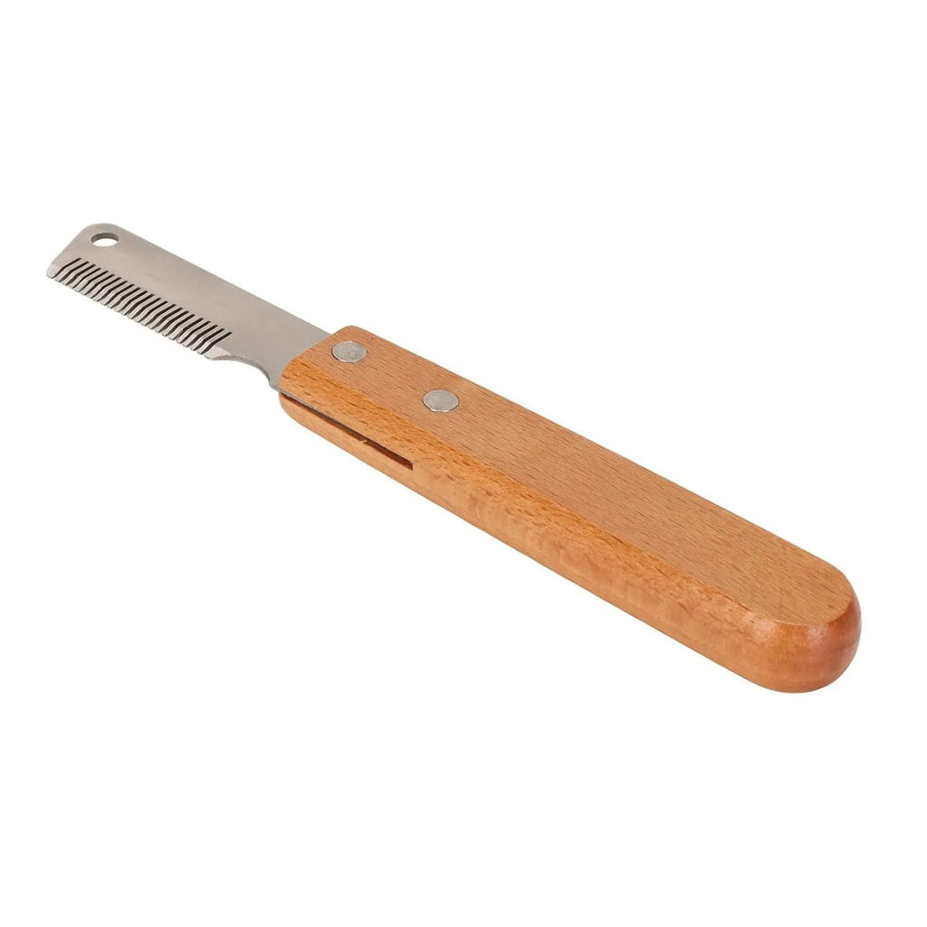 Wooden handled pet stripping comb grooming tool for dogs and cats on a table.