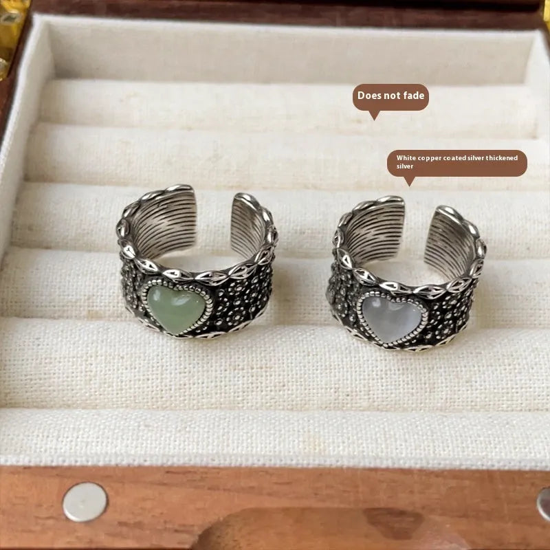 Retro wide-faced heart-shaped ring with adjustable opening in silver finish.