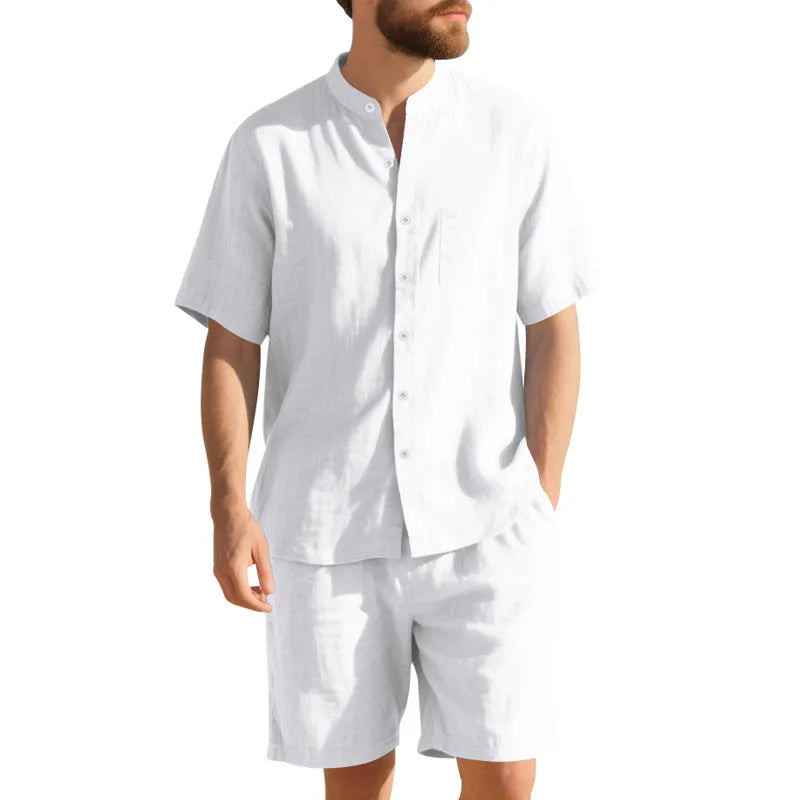 Men's light blue linen blend summer suit with Henry collar shirt-style jacket and matching shorts on a hanger.