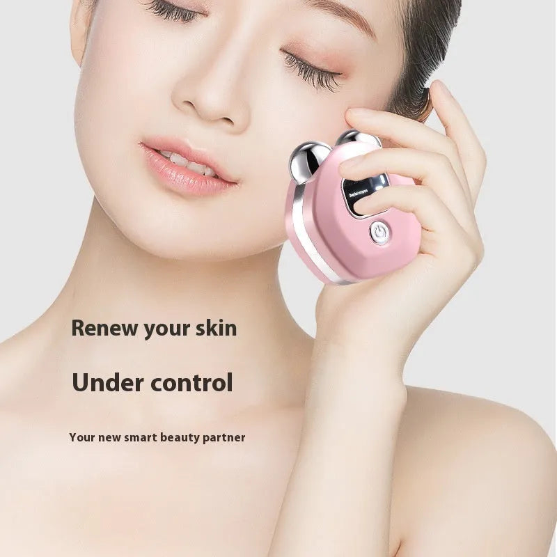 Portable white microcurrent facial massage instrument with dual rollers and charging cable