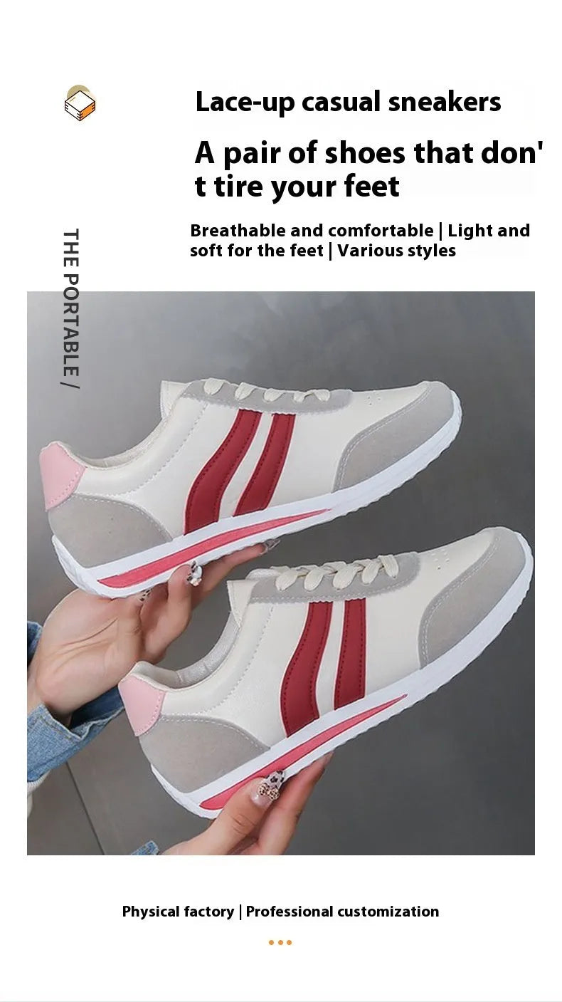 Red and blue low-top lace-up sneakers with rubber sole and mesh upper on white background