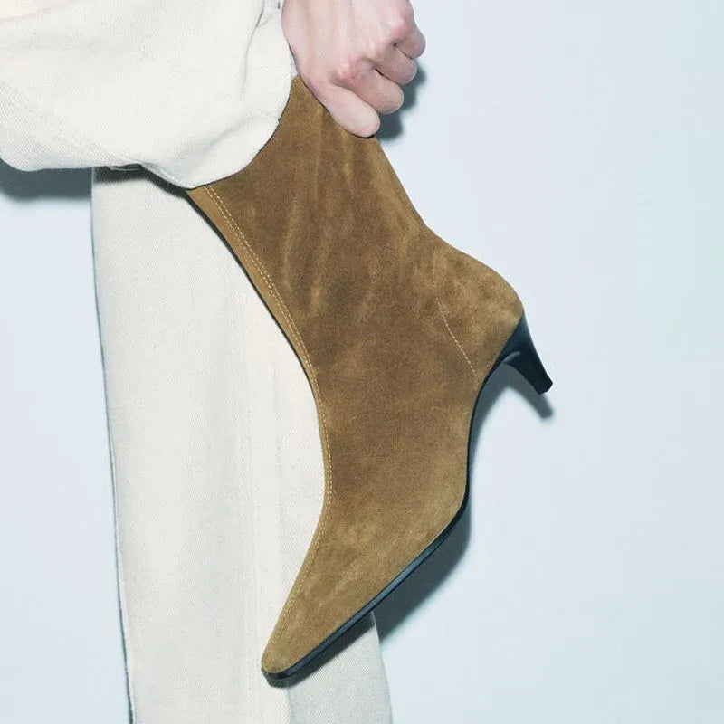 Brown square toe ankle boots with a side zipper and a mid-height kitten heel on a waterproof platform.