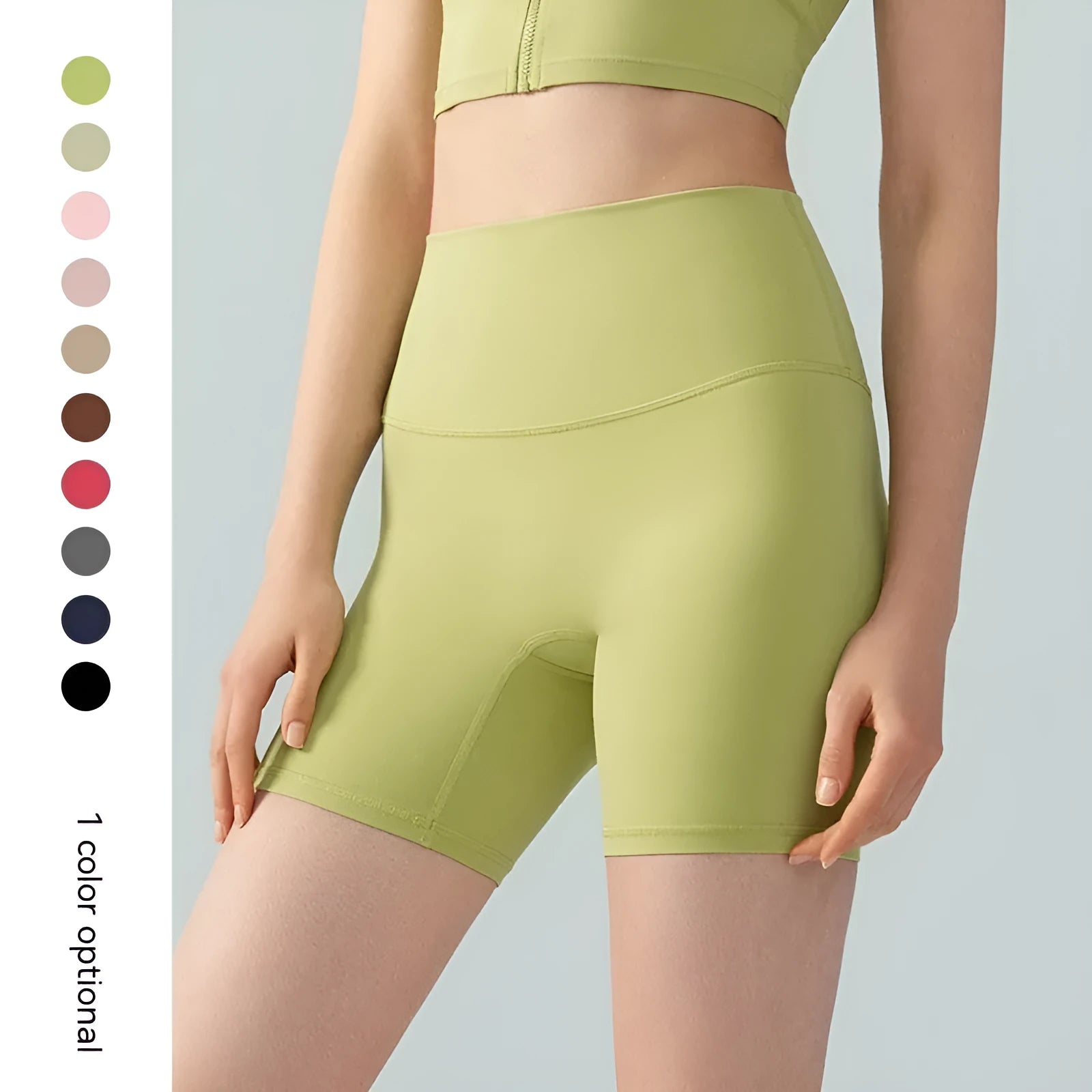 Woman wearing high-waisted leaf green Lycra yoga shorts with a four-point anti-exposure design.
