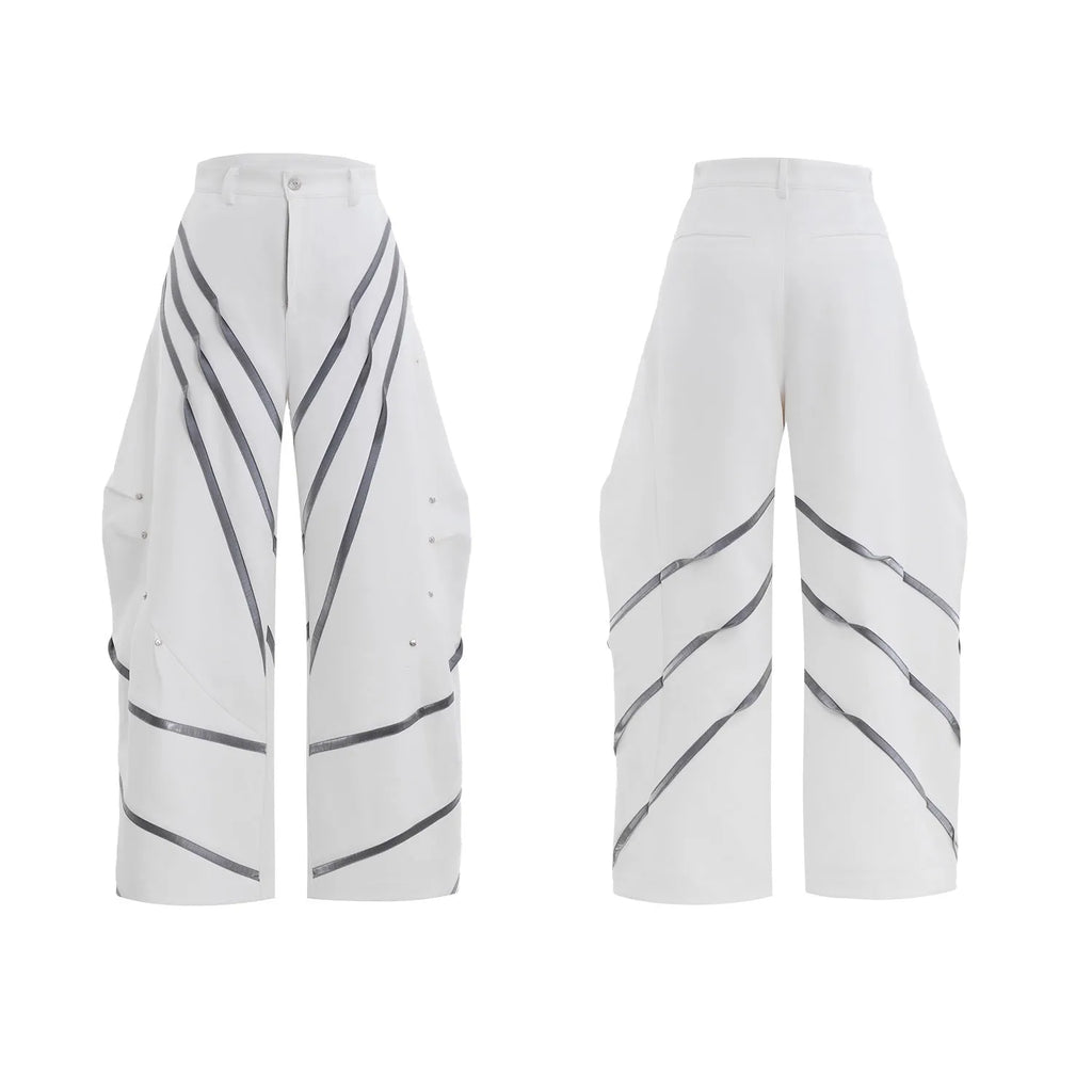 Men's polyester trousers with metal rivet accents and pleated detailing on three-dimensional cutting construction
