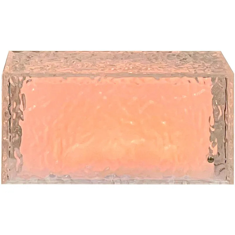 Geometric acrylic ice cube night lamp with colour changing LED lights on dark surface