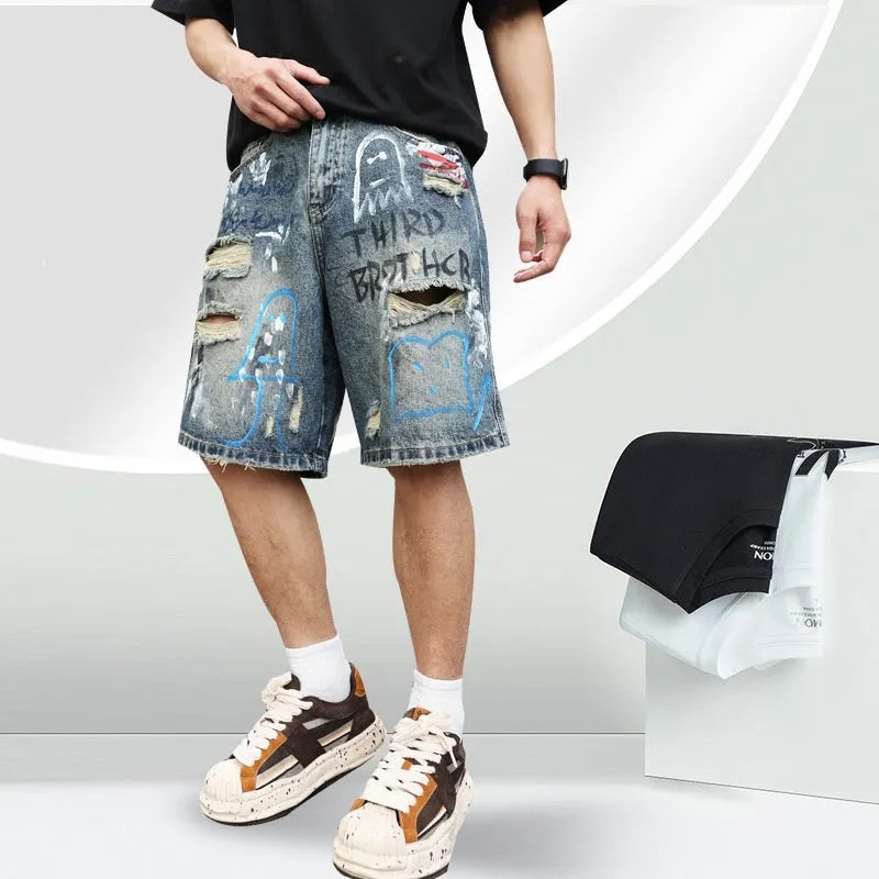 Men's blue ripped jeans shorts with graffiti details and straight leg opening