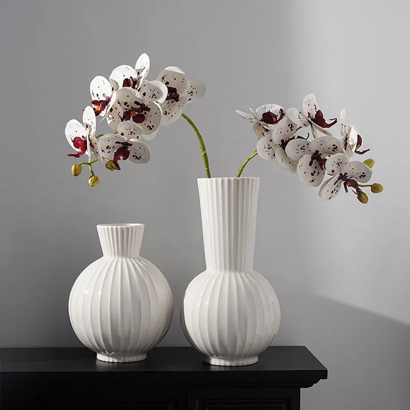 American country style ceramic vase with white base and blue stripes on living room table