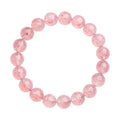 Natural white strawberry quartz crystal ball bracelet with 10mm spherical beads on wrist.