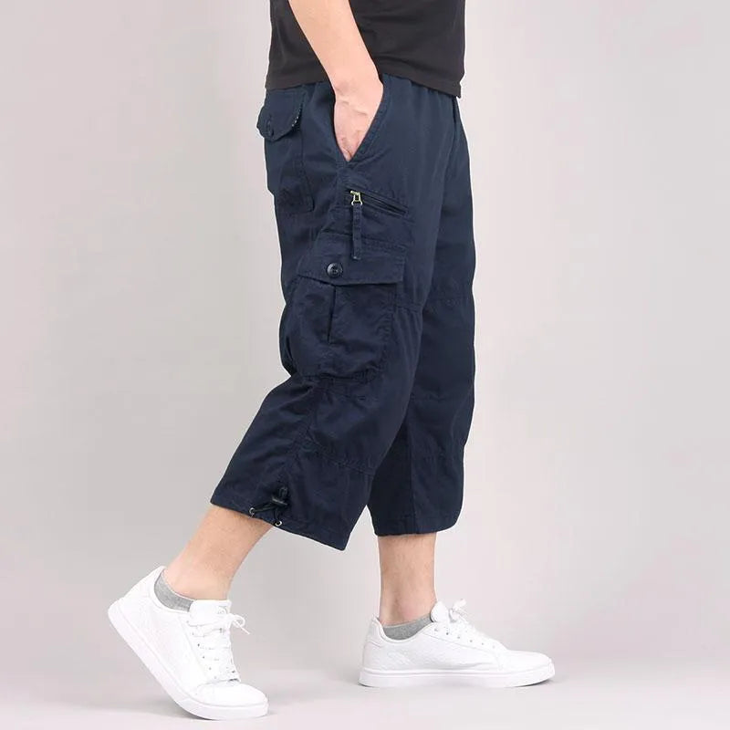 Men's casual cotton cropped pants in loose fit available in khaki, black, dark grey, and army green colours