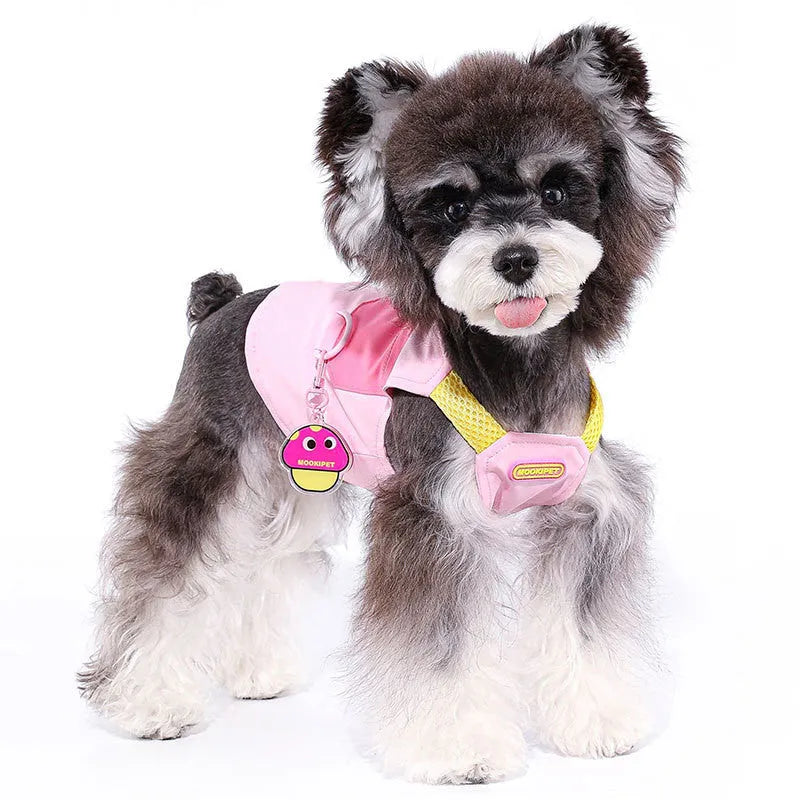 Pink polyester pet vest for small to medium dogs on a Bichon Frise