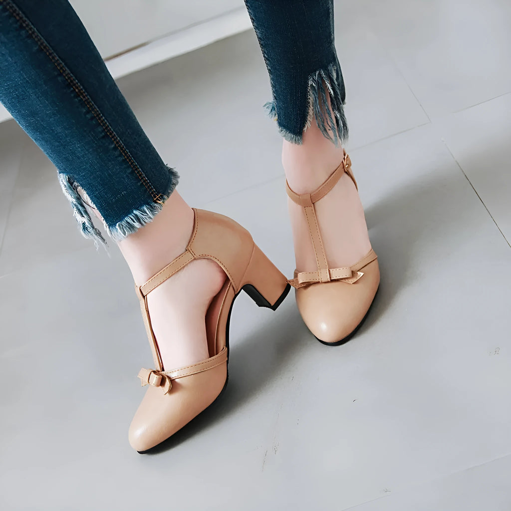 Women's chunky heel sandals with bow tie detail and adjustable buckle strap in apricot colour