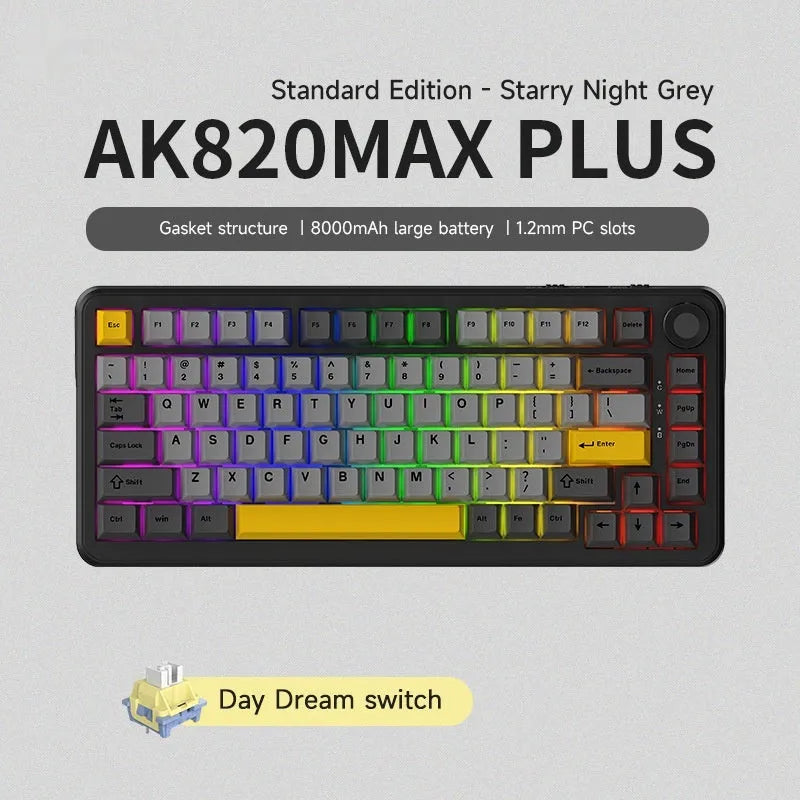 Black, grey, and yellow three-mode wireless mechanical keyboard with UK layout on a desk.