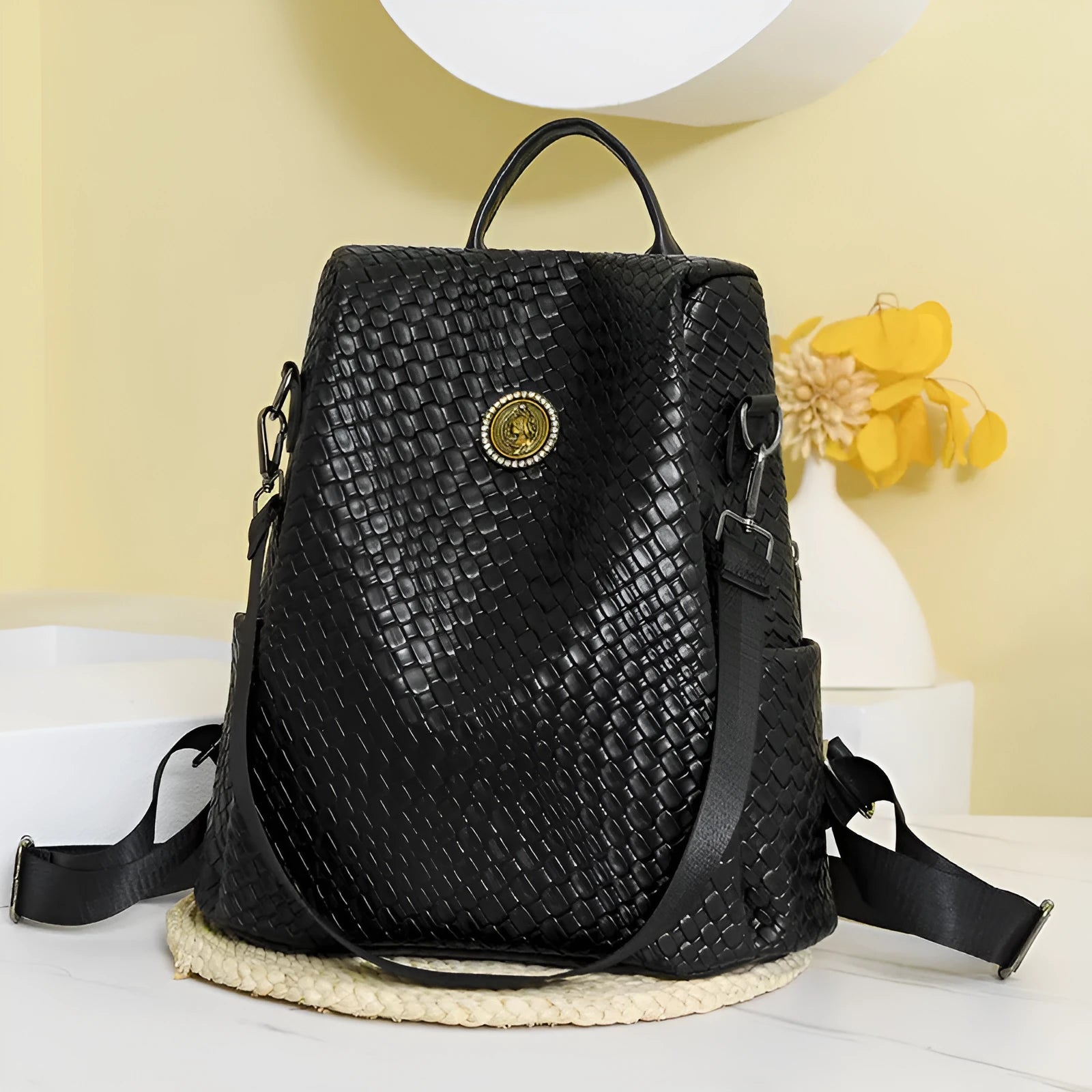 Women's anti-theft backpack with waterproof PU construction showing organisational compartments and urban simplicity styling