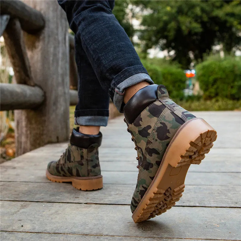 Men's pink high-top Martin boots with round toe and front lace-up on a flat bottom.