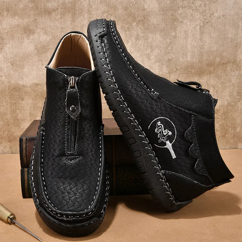 Men's black slip-on casual loafers with round toe and rubber sole on a white background.