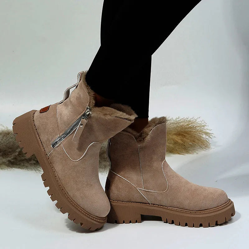 Women's black faux suede high-top snow boots with a side zipper and thick plush lining.