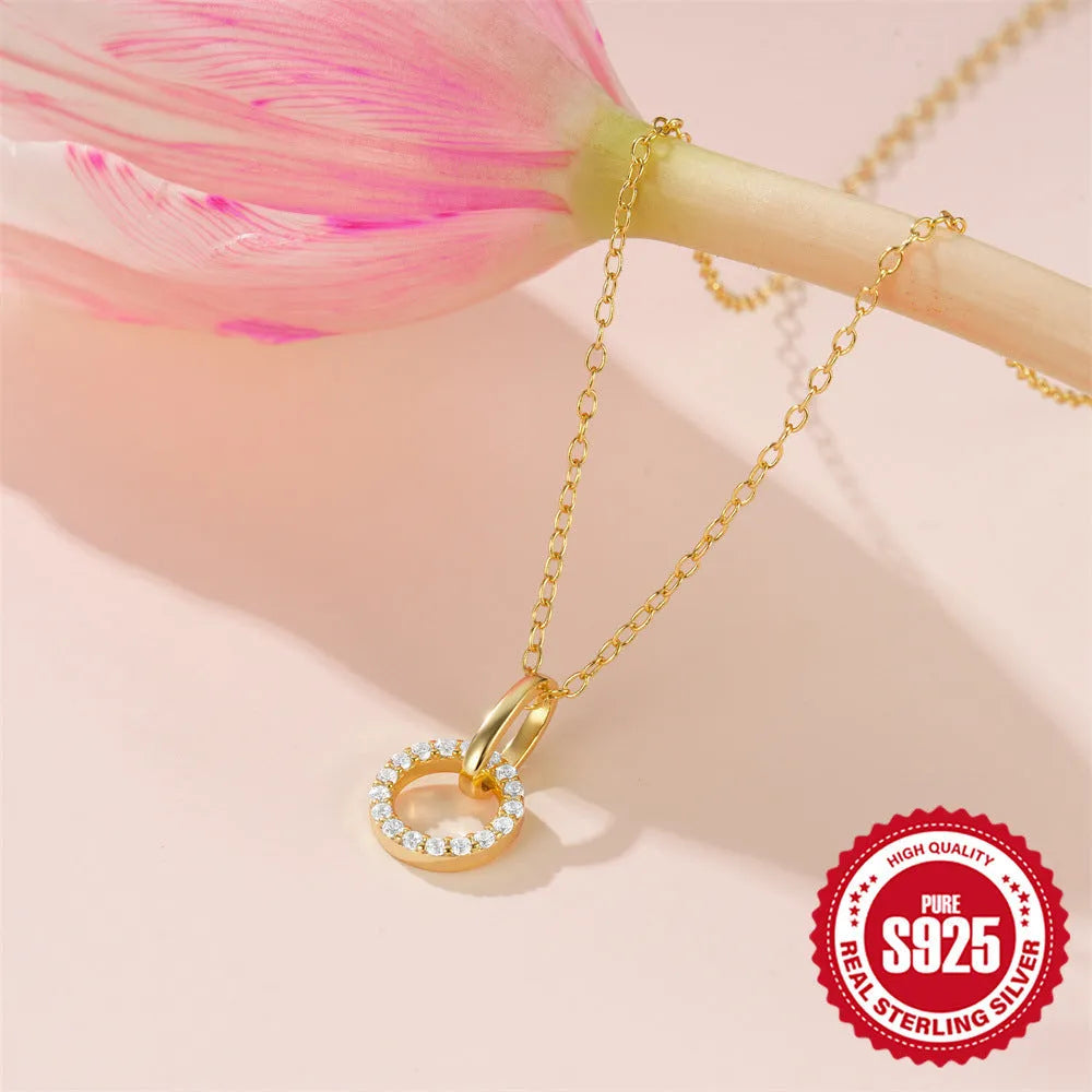Gold colour S925 sterling silver necklace with geometric interlocking pendant containing micro inlaid zircon stones
