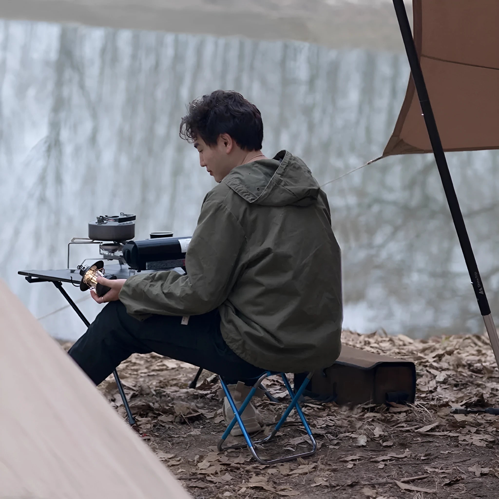 Black national style aluminium alloy folding stool shown in folded and unfolded positions.
