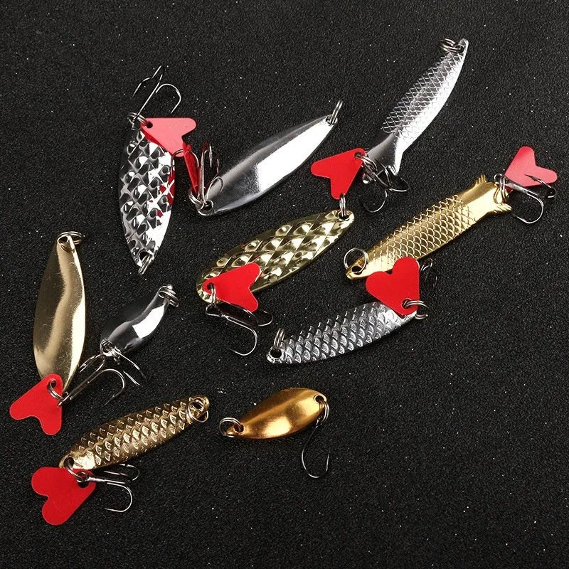 Pineapple design fishing lure with metal sequins on a box iron false bait body