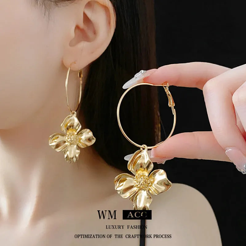 Silver Needle geometric flower design drop earrings in gold or silver electroplated metal alloy