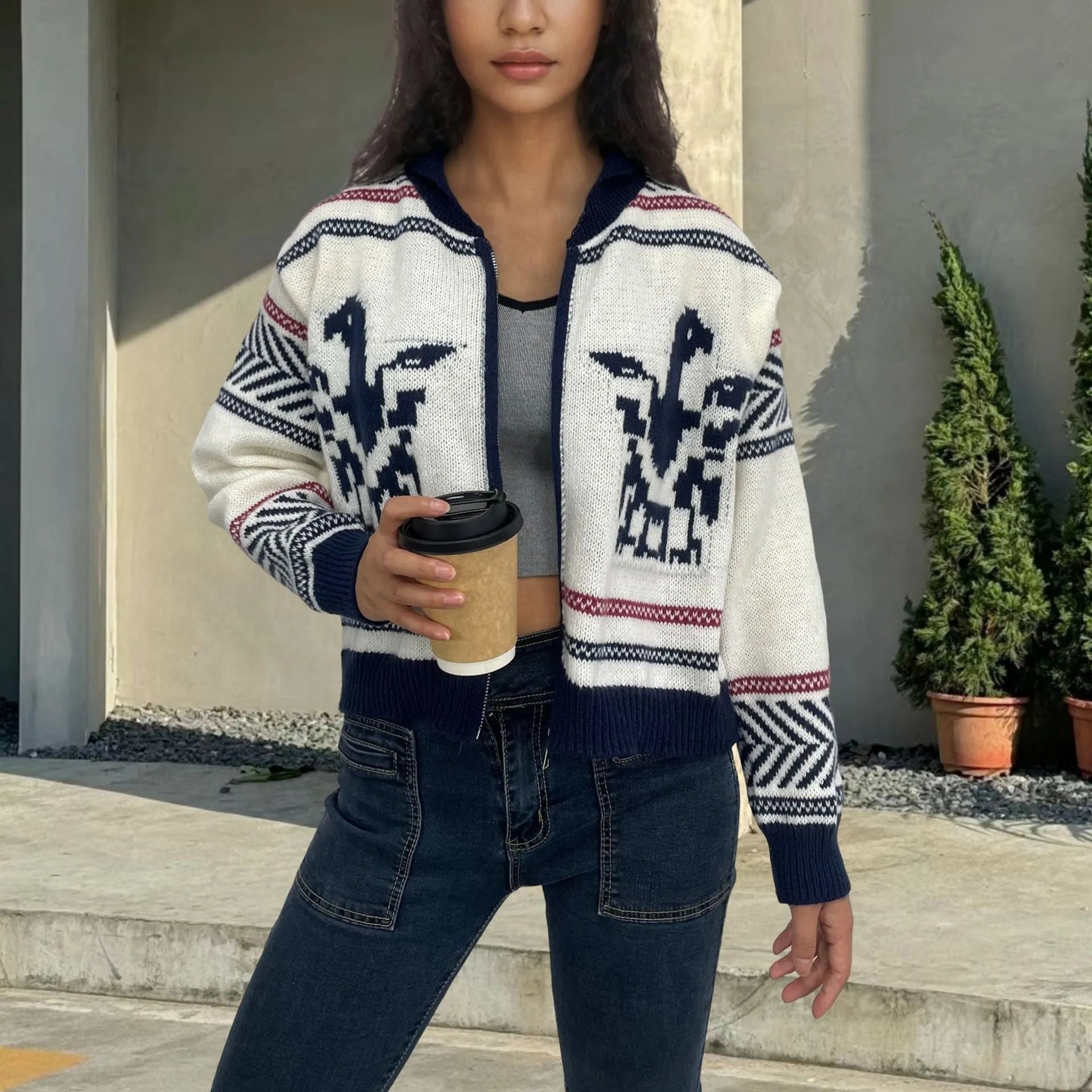 White women's short zip cardigan with lapel collar and contrast jacquard stripe pattern.