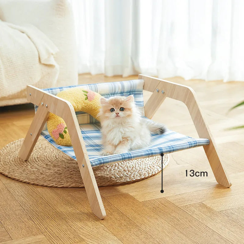 Wooden cat hammock bed with elevated design and cloth sleeping surface in blue colour