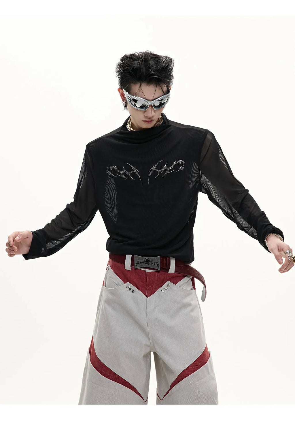 Man wearing a black niche mesh slim-fit long sleeve shirt showing texture and fit.