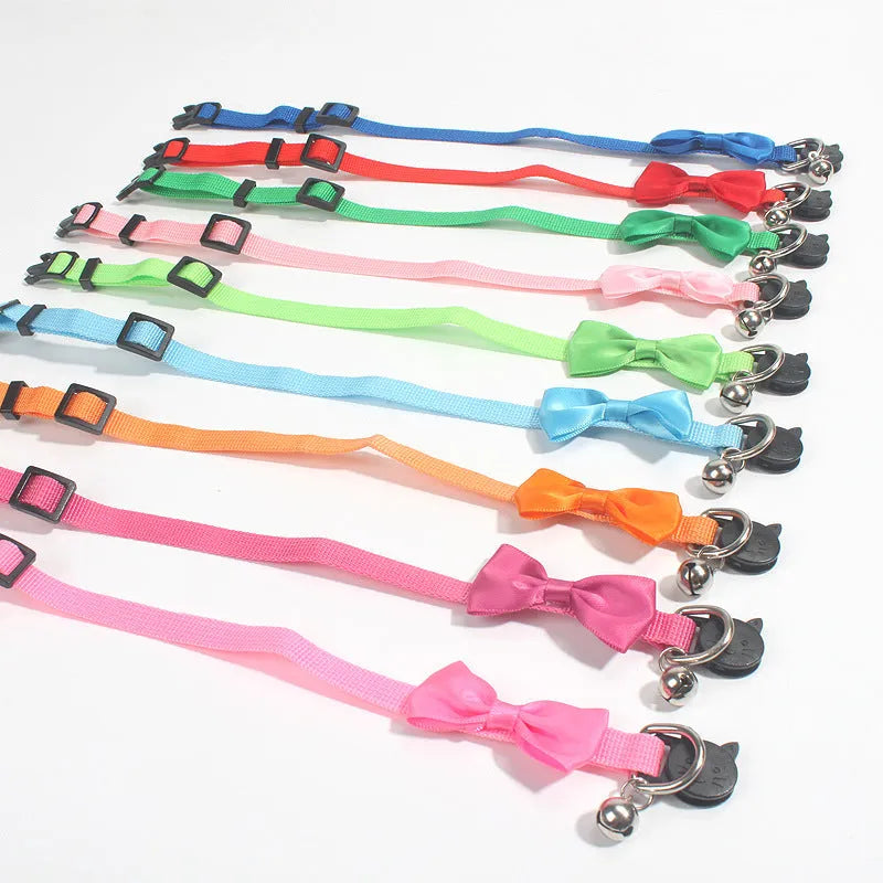 Striped nylon cat collar with bow decoration and bell in multiple colour options