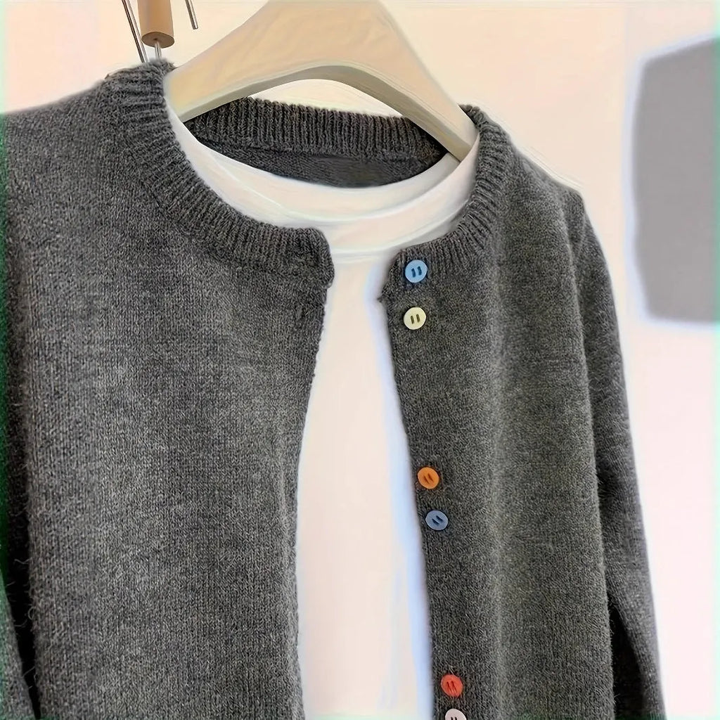 Dark grey women's button-front polyester cardigan on a hanger.