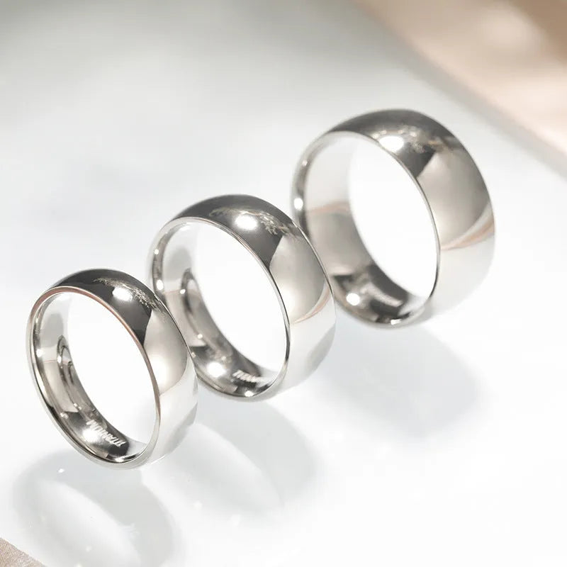 Silver titanium steel ring shown in three width options: 2mm, 4mm, and 6mm.