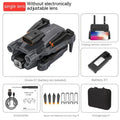 Black quadcopter drone with camera folded on a surface next to its remote control.