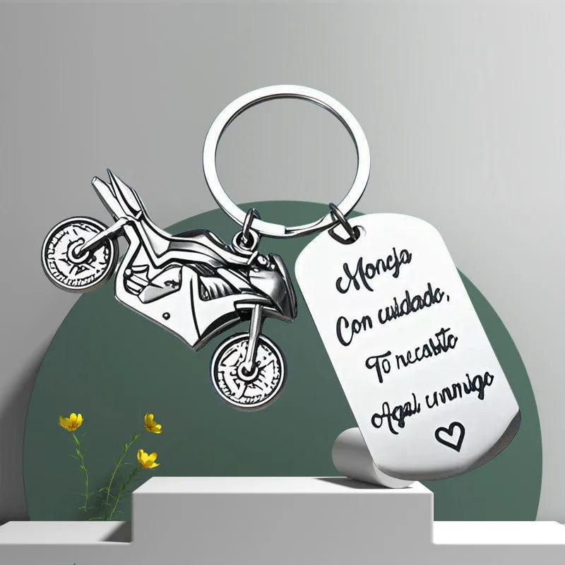 Stainless steel motorcycle keychain with inspirational design and a flannel bag