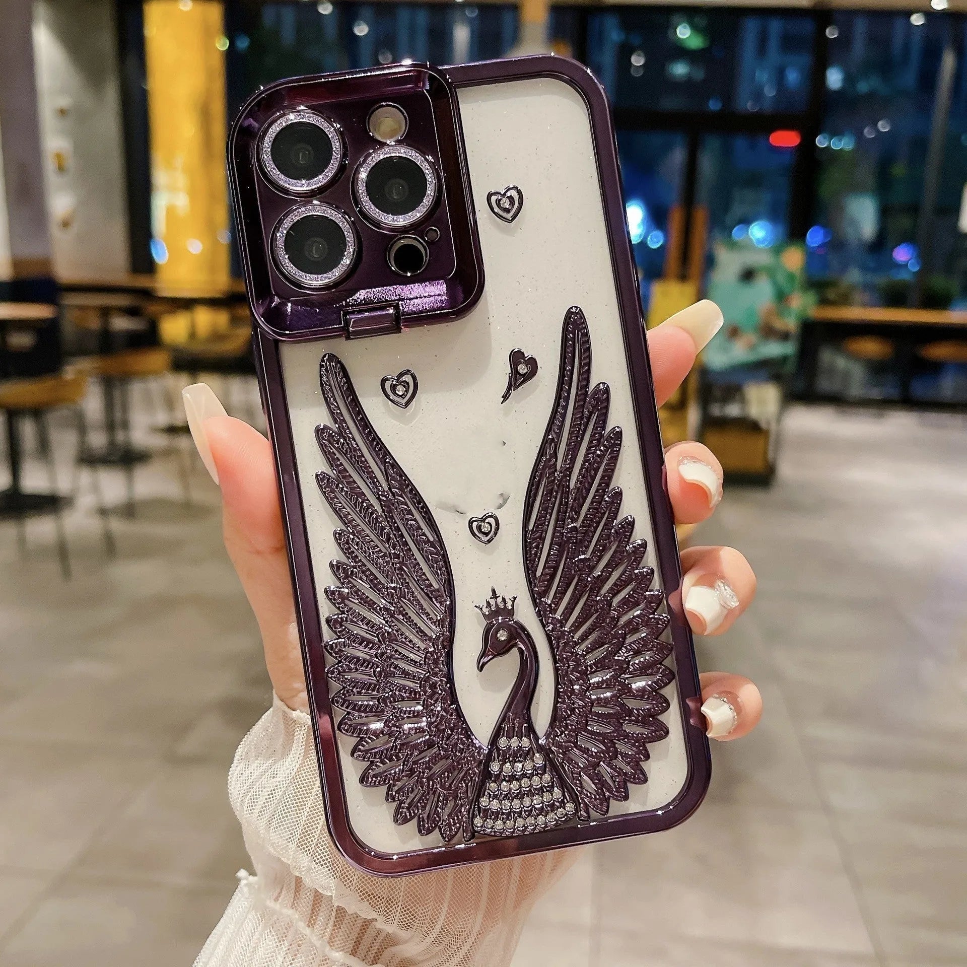 TPU phone case with electroplated three-dimensional angel wing frame and built-in invisible bracket, transparent back, shown in black