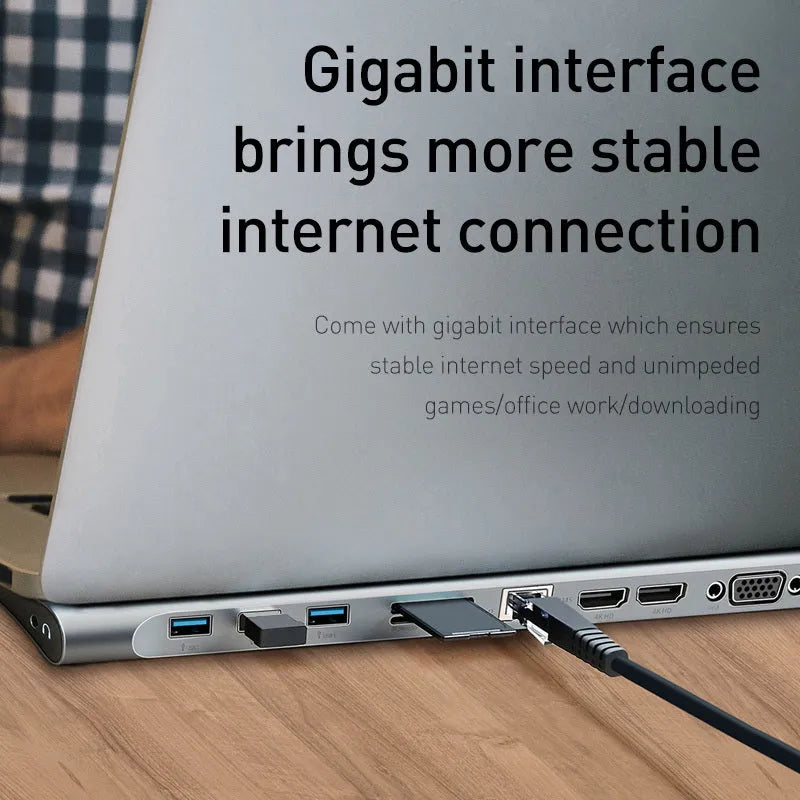 Grey aluminium alloy laptop docking station cooling bracket with ten-port connectivity hub.