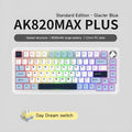 Black, grey, and yellow three-mode wireless mechanical keyboard with UK layout on a desk.