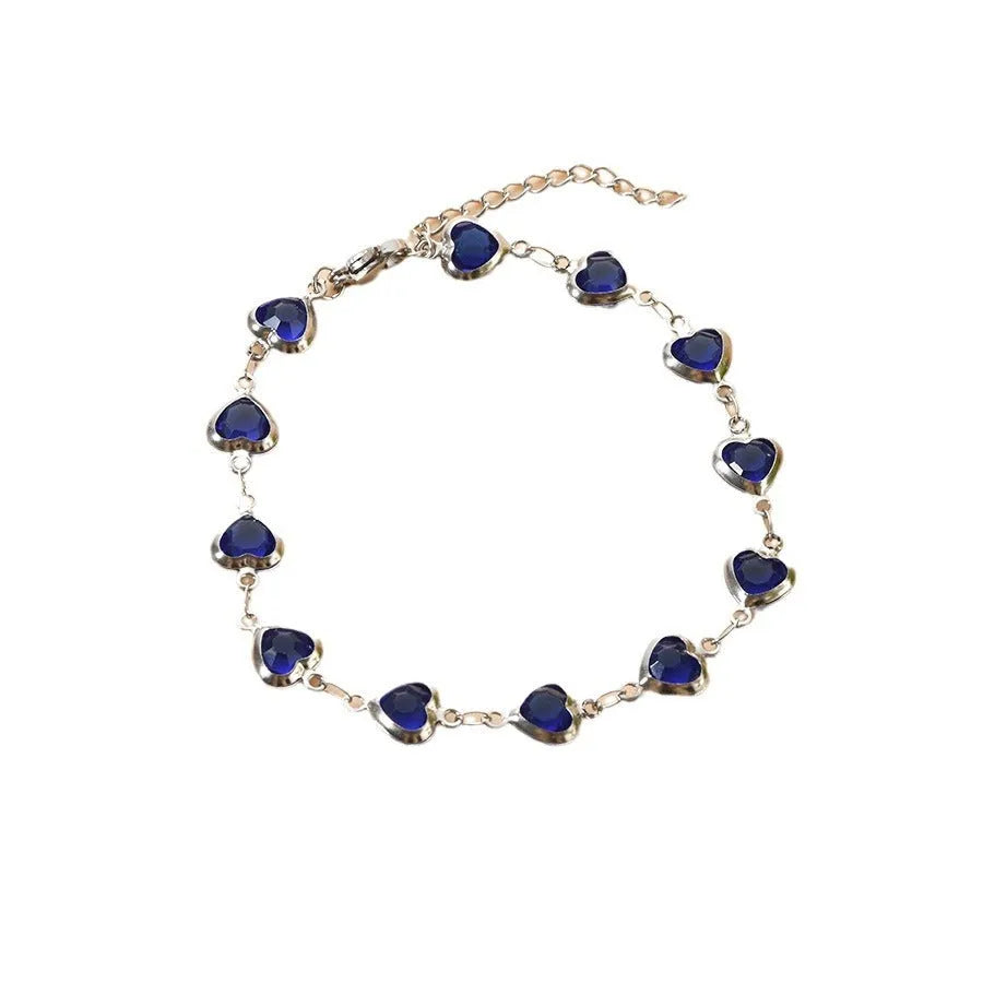 Devil's Eye Creative stainless steel geometric heart bracelet in an electroplated colour on a wrist.
