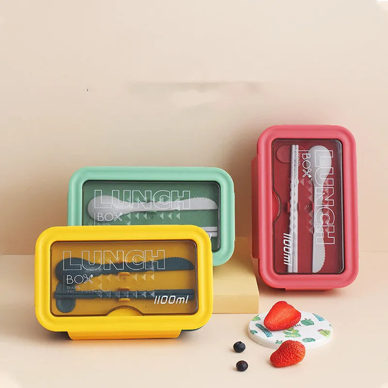 Green four-layer partitioned bento lunch box with Nordic style design, shown open.