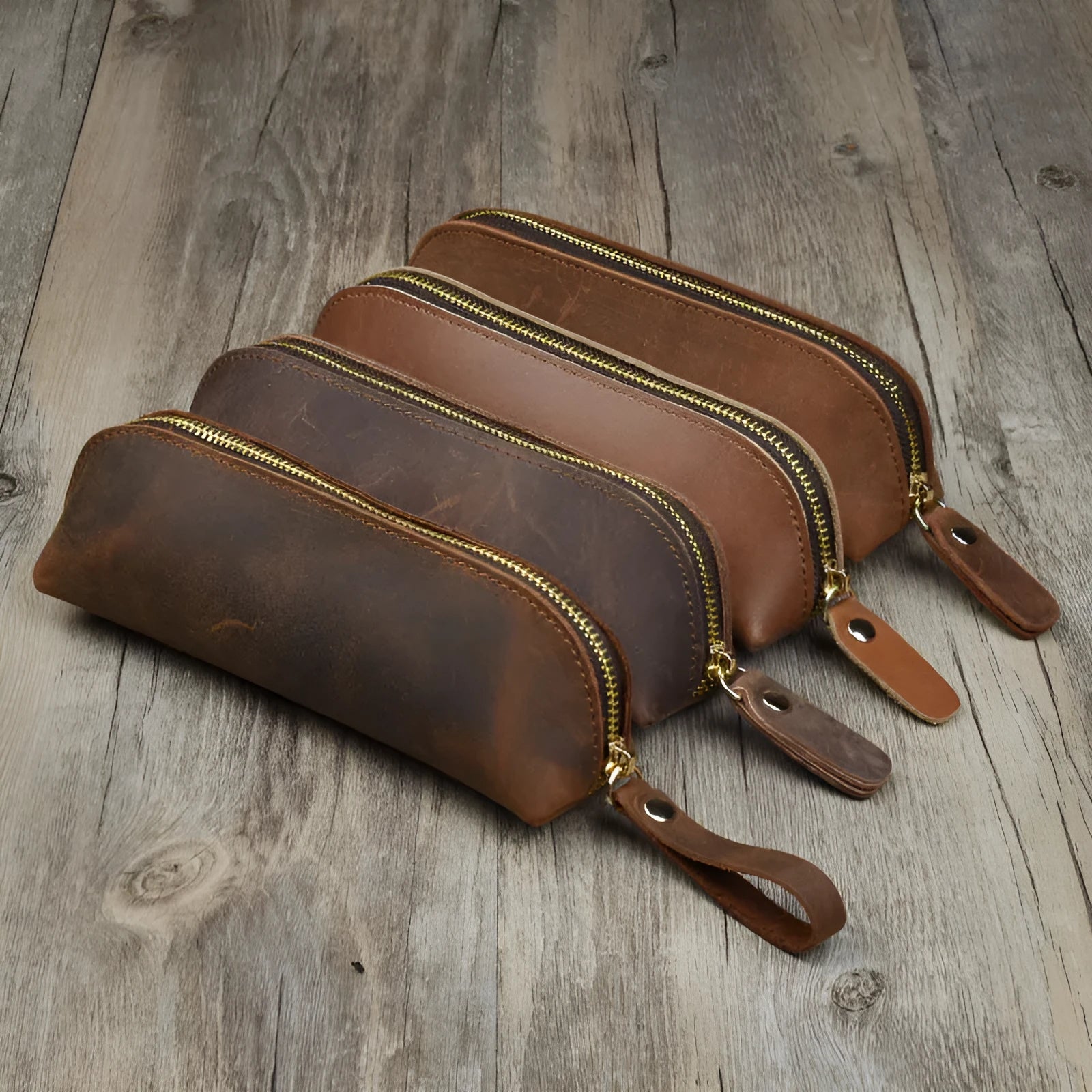 Handmade square leather pencil case with zipper in black, brown, dark brown, or yellow.