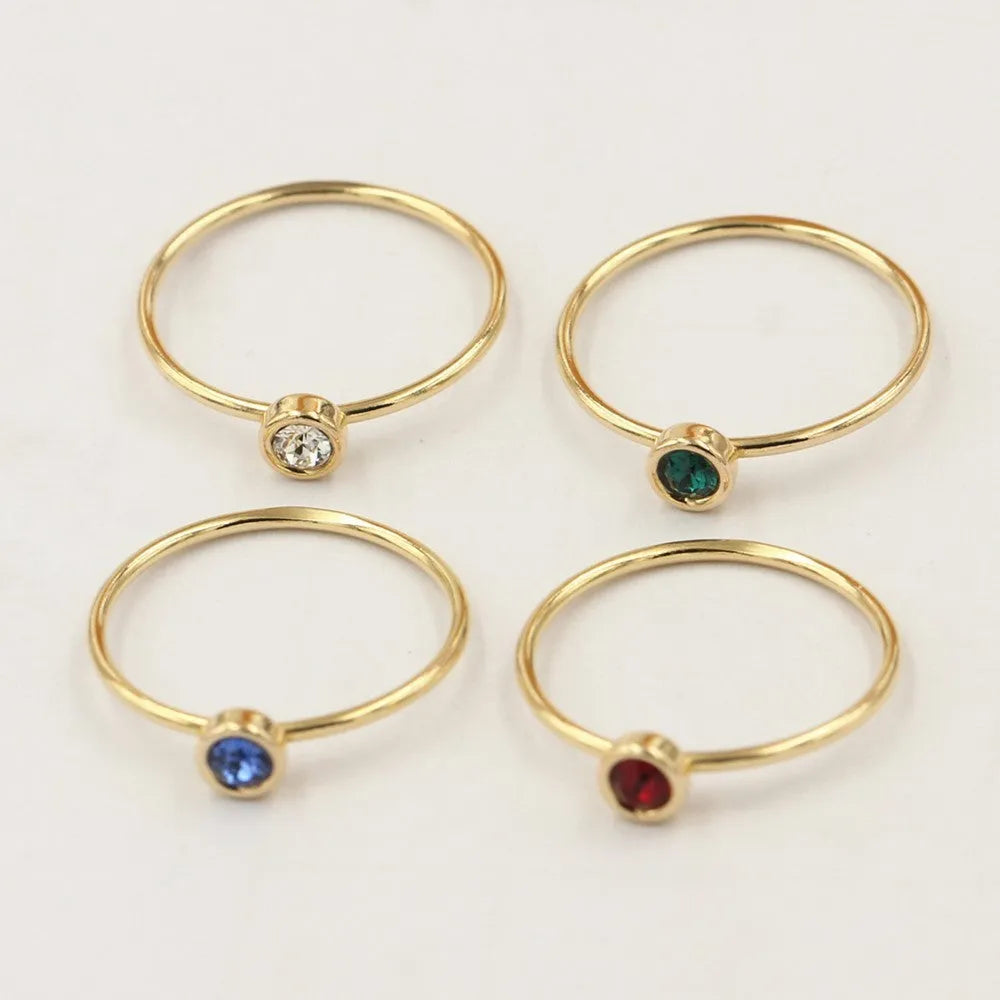 Women's 14K gilded copper knuckle ring with green cubic zirconia stone in US size 7.