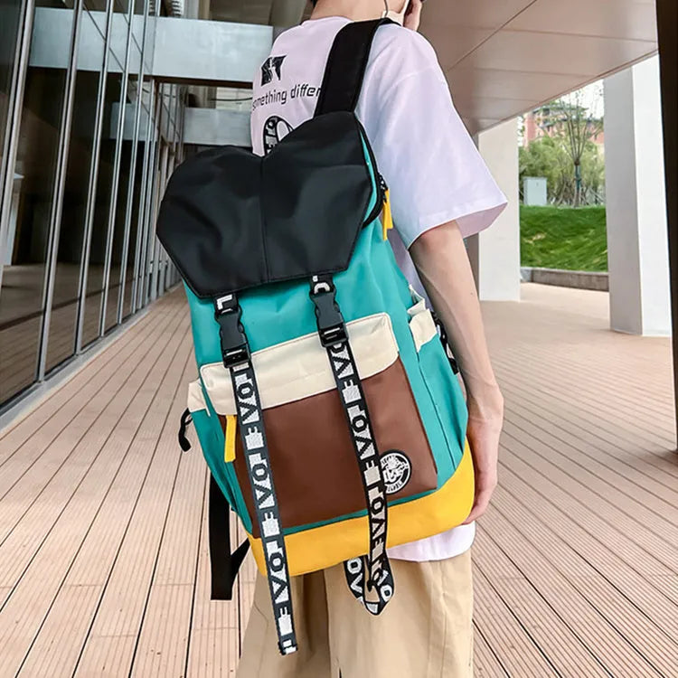 Oxford cloth student backpack shown in black, green, or red with multiple carry straps.